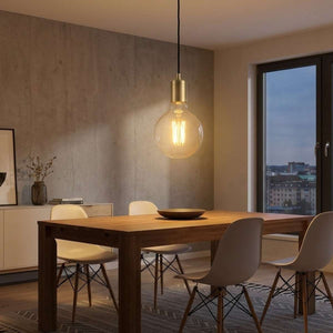 Lampadina LED Globo G125 E27 vetro trasparente 18W accesa.